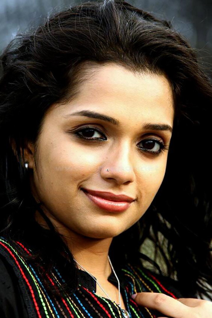 Ann Augustine as Radhika in Autorickshawkkarante Bharya