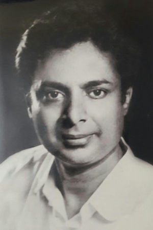 Shani Mahadevappa as Rajaram's House Servant in Trimurthy