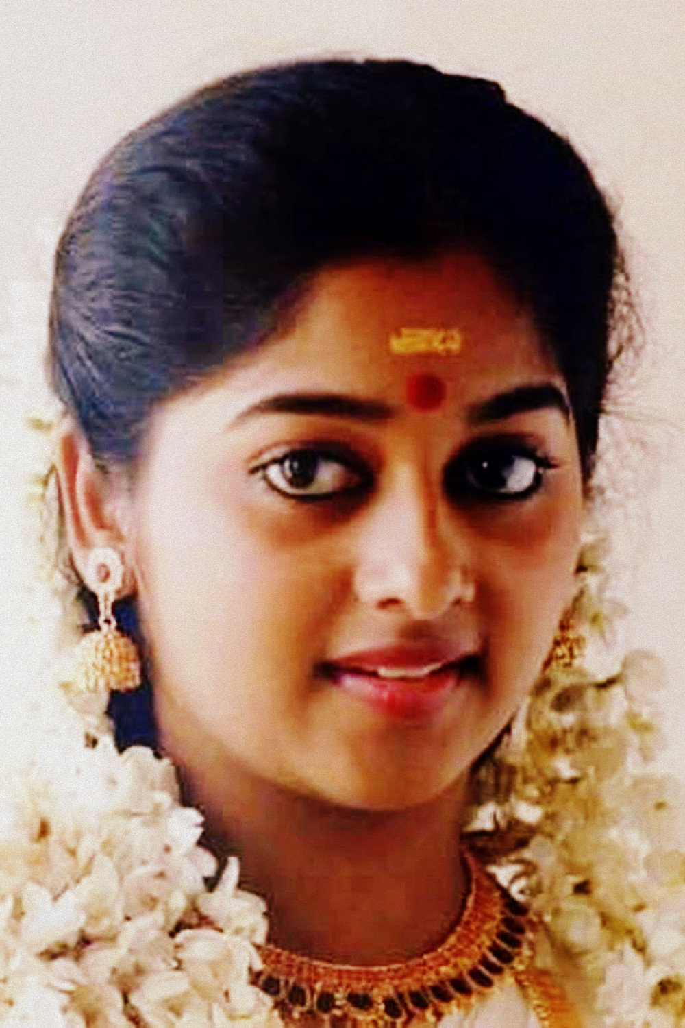 Monisha Unni as Geetha in Adhipan