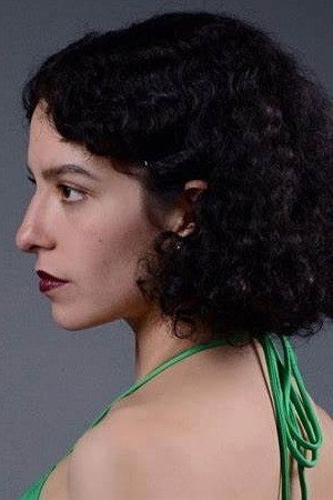 Frida Alcántara as Aurora in Reminiscence