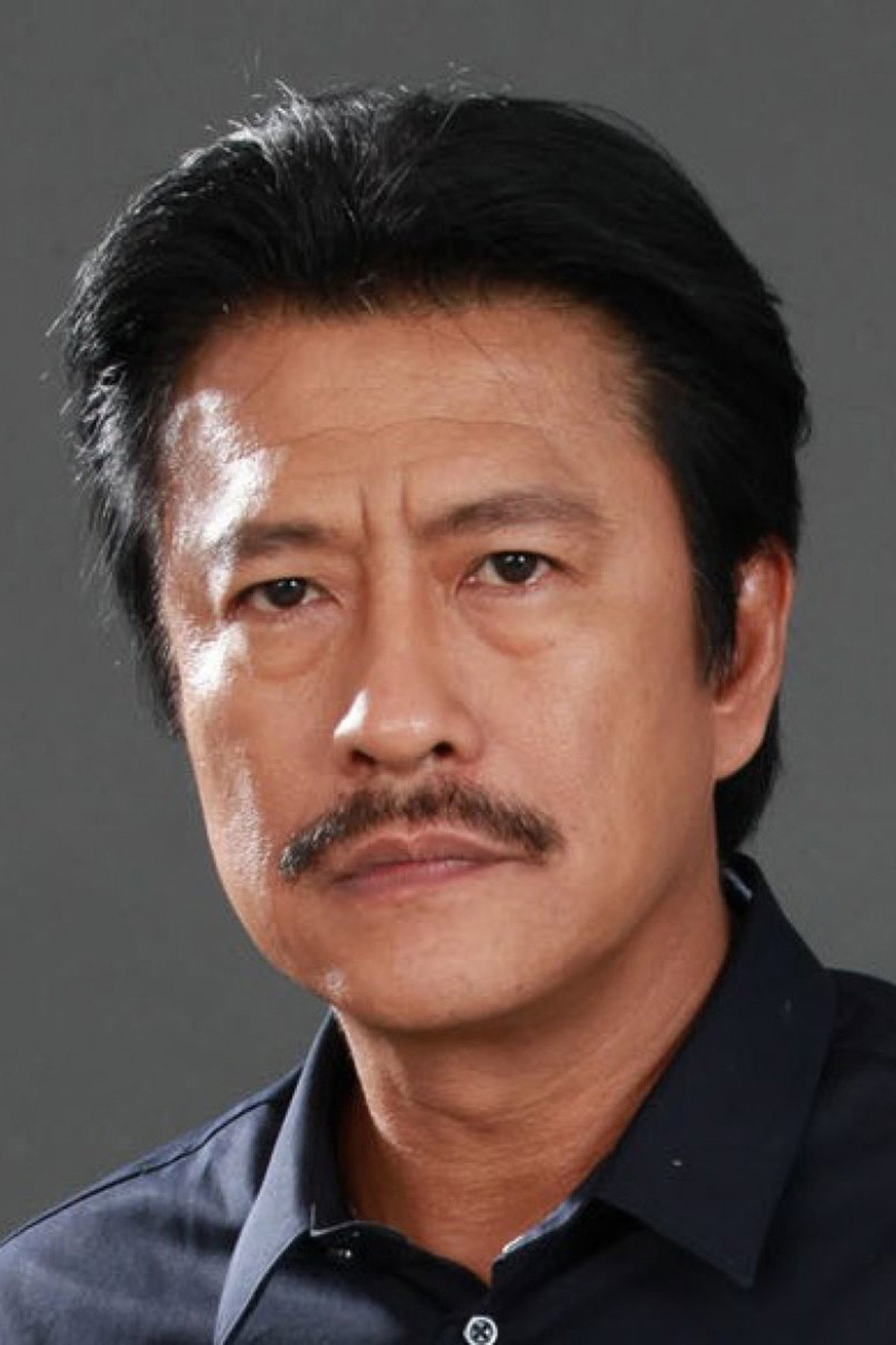 Sakrat Ruekthamrong as Uncle Tim in Mae Bia