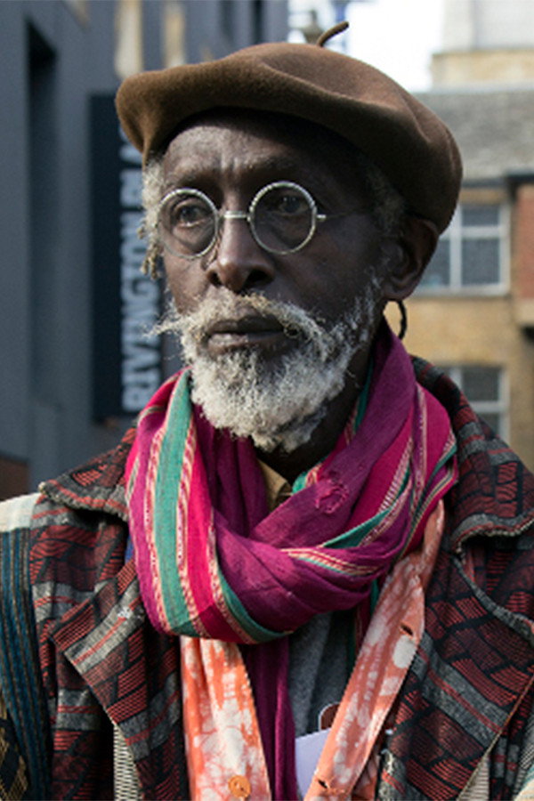 Issa Samb as The Professor in Hyenas