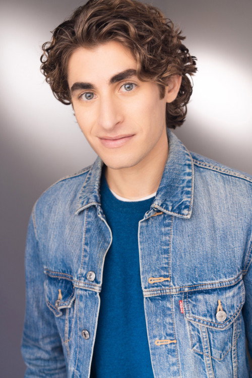 Adam Santa Cruz as Beta Hugo in Accidental Surrogate for Alpha