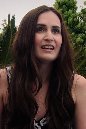 Shauna Richardson as Scarlet in Next Door