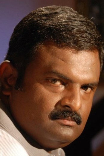 P.L. Thenappan as Ekambaram in Kurangu Bommai