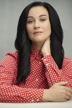 Kyla Wise as Andrea Kondracke in Saving Milly