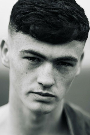Lewis Brophy as Oisín O'Brien in Spilt Milk