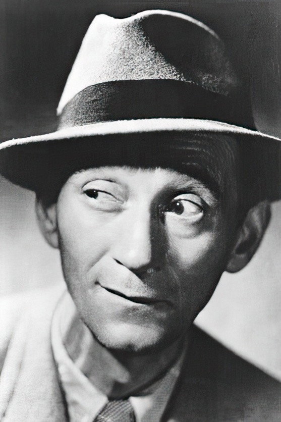 Raymond Aimos as Vic, policeman in Captain Benoit