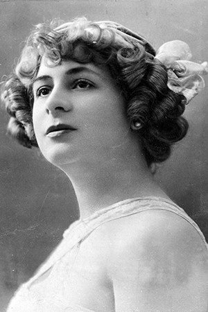 Armande Cassive as La Présidente in He Is Charming