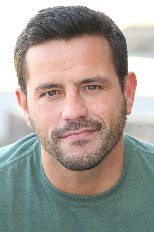 Brooks Ryan as Roomate in Born in Prison
