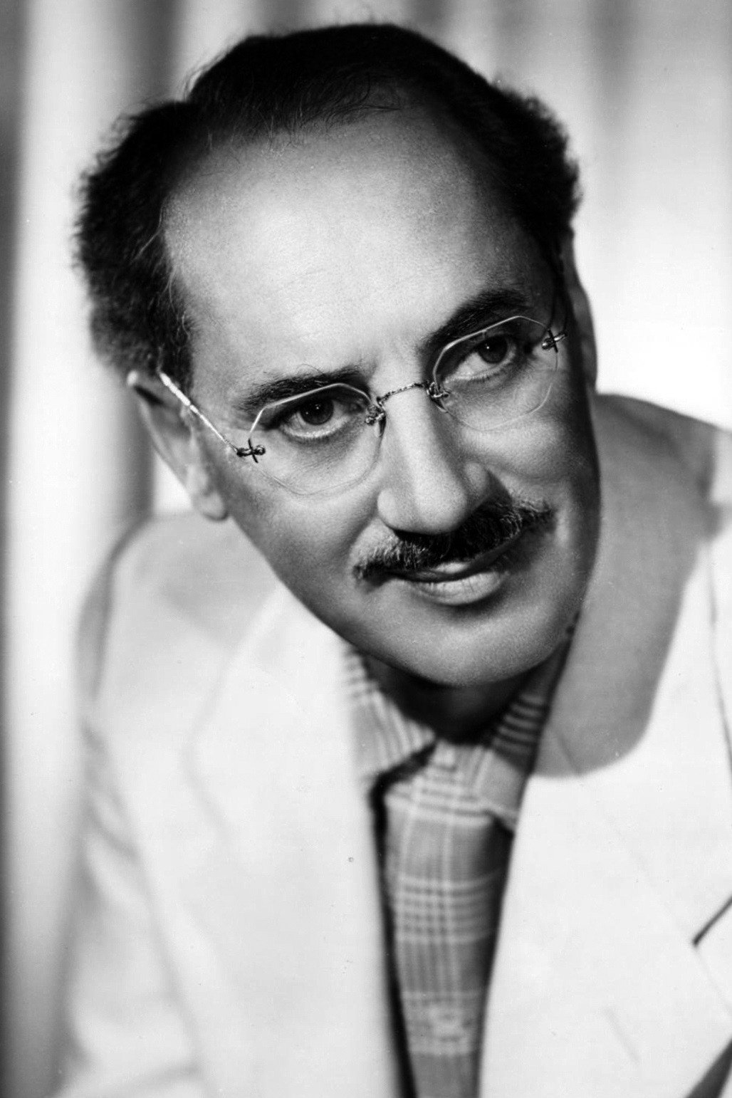 Groucho Marx as Benjamin Franklin 'Benny' Linn in A Girl in Every Port