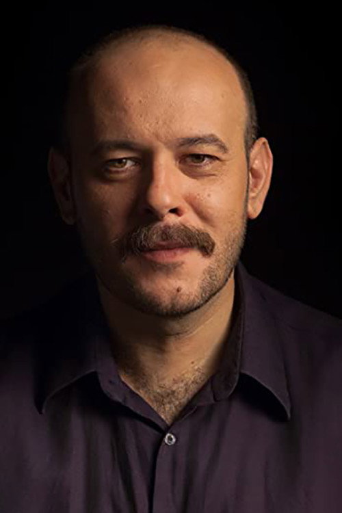 Ljubomir Bandović as Poštar Mića in Bitter Fruit