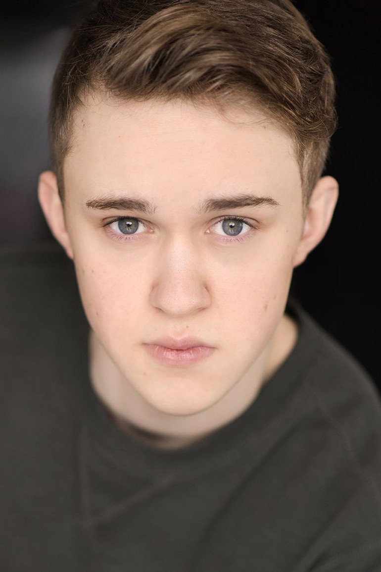 Connor Stanhope as Logan Shannon in Garage Sale Mysteries: Murder In D Minor