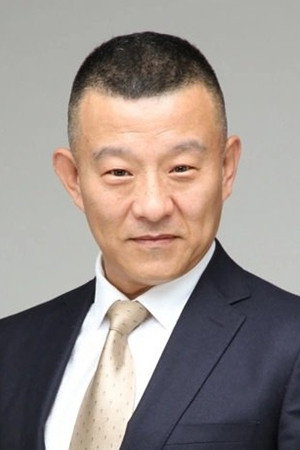 邓钢 as Bureau Chief in The Raid