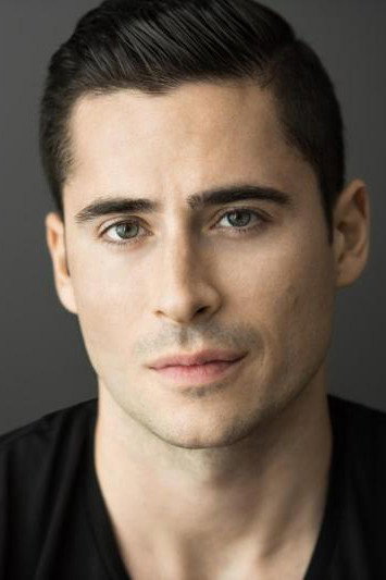 Olivier Renaud as Brett Matthews in Planes, Trains, and Christmas Trees