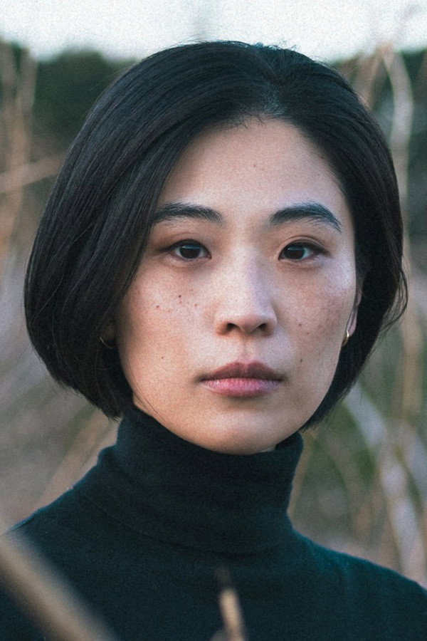 Shuna Iijima as Li in Be My Guest, Be My Baby