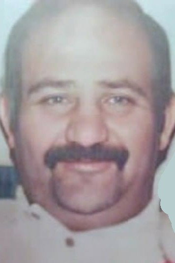 Ali Zahedi as Hossein in The Millionaire Beggar