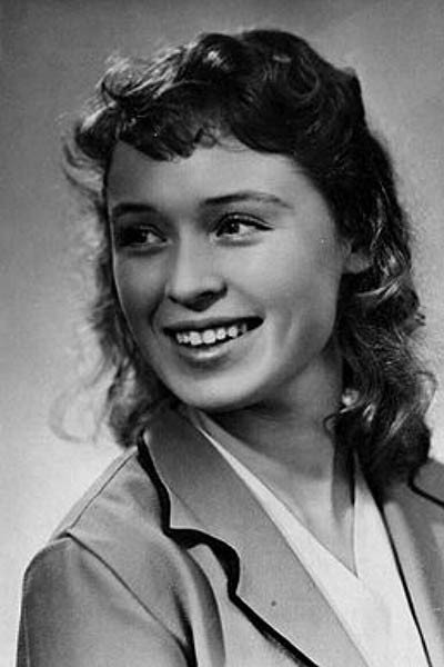 Valentina Khmara as Pioneer leader in A Traveller with Luggage