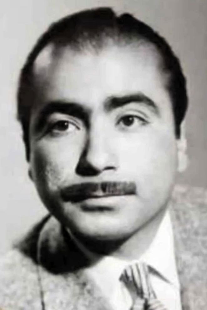 Gholamhossein Bahmanyar as Hassan SagDast in The Love Taxi