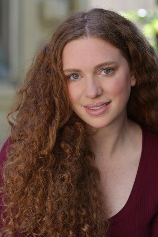 Flannery Mays as Joan in The Last Day of Retrograde