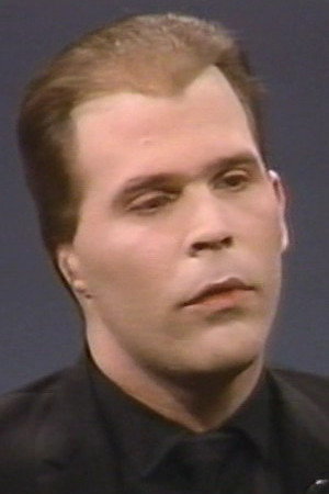 Nikolas Schreck as Catholic Priest in Usher