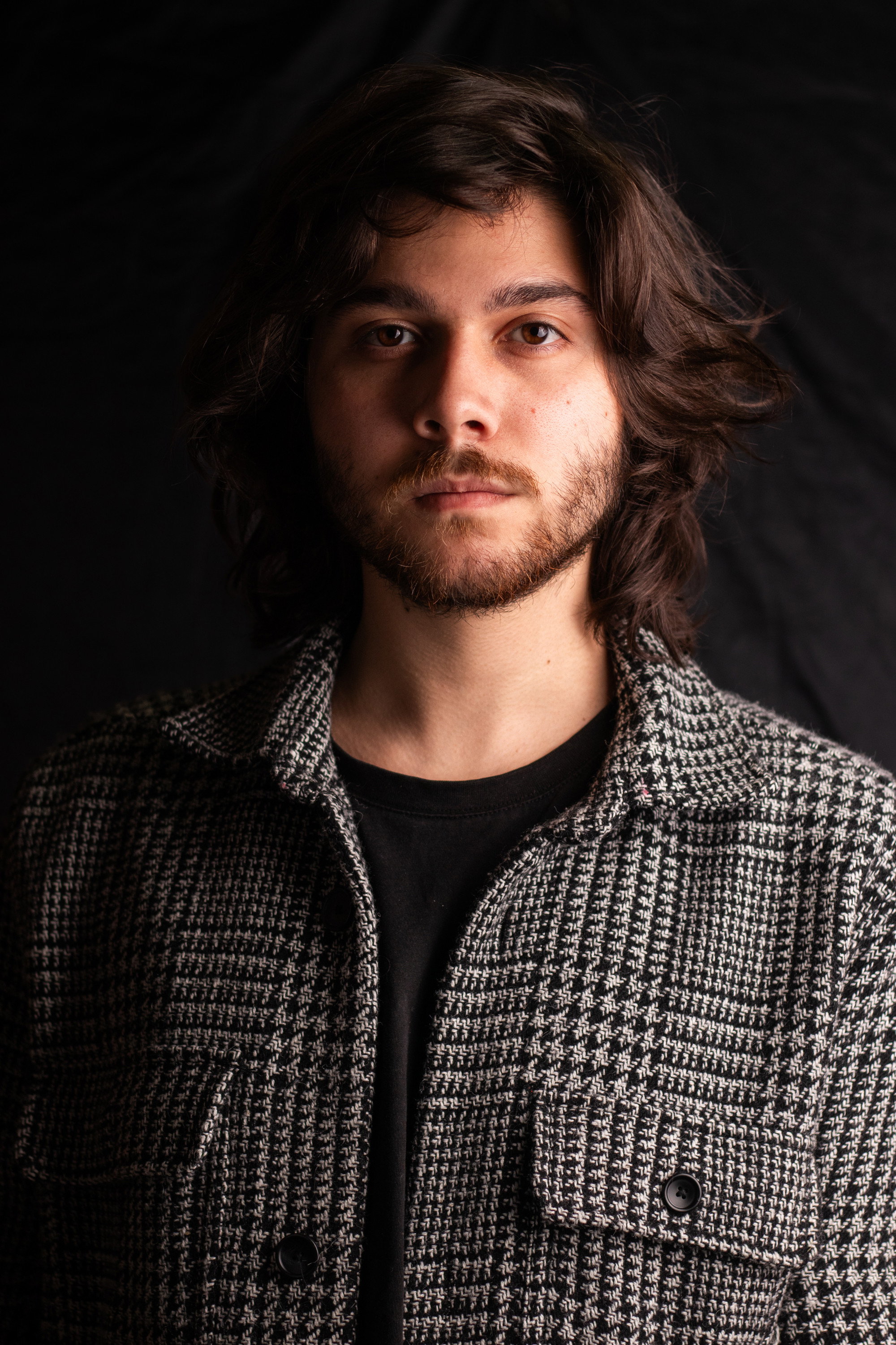 Bernardo Appel as Carlos in Confluence