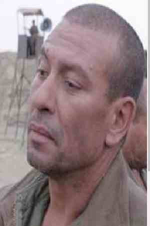 Ahmed Rezzak as Commandant Ferradj in Lotfi