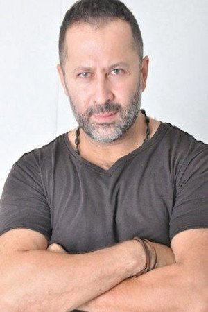 Hossam Fares as حسن in Family Group Stories