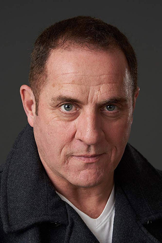 Mike Foenander as Convenience Store Patron in System Error