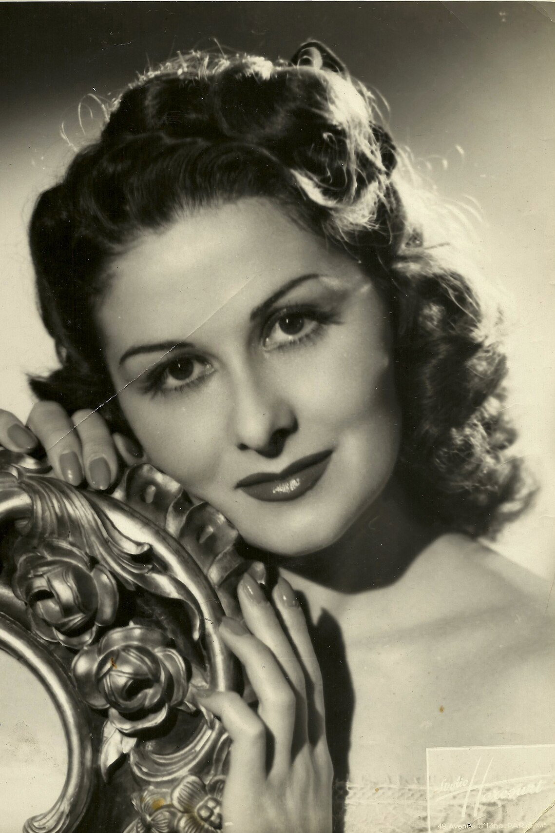 Gaby Wagner as La cocotte du 27 in At Your Command, Madam