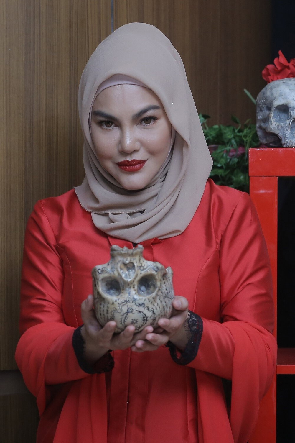 Umie Aida as Dewi in Gangster