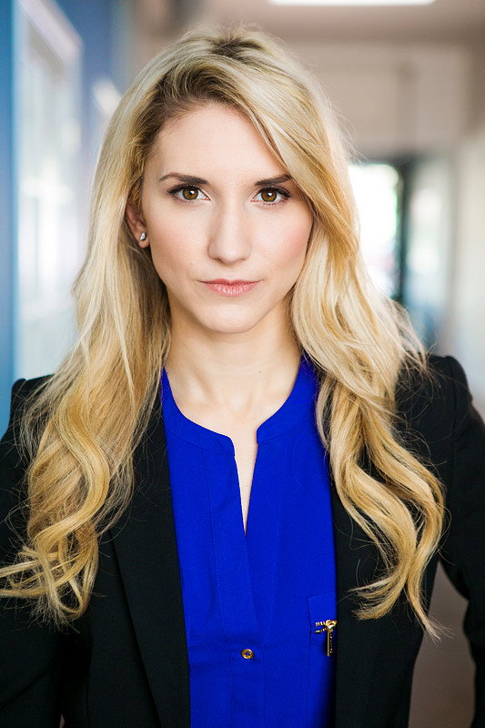 Krystin Goodwin as Newscaster / Radio Show Host in Flesh & Blood