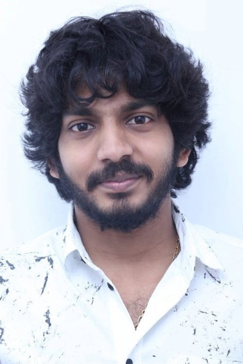 Sam Jones as Bala, Tamilarasan's Driver in Dharma Prabhu
