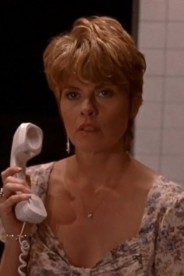 Melanie Norris as Helen Moss in Manhattan Murder Mystery