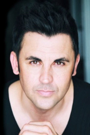 Denton Blane Everett as Coach Chuck in Hurricane Bianca: From Russia with Hate