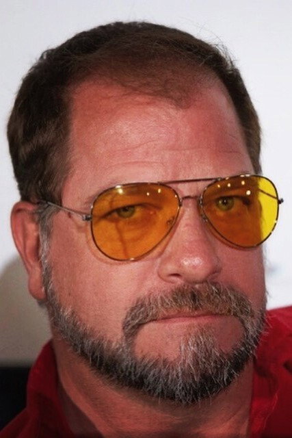 Thomas Downey as Father Thomas Bates in Exorcism: The Possession of Gail Bowers