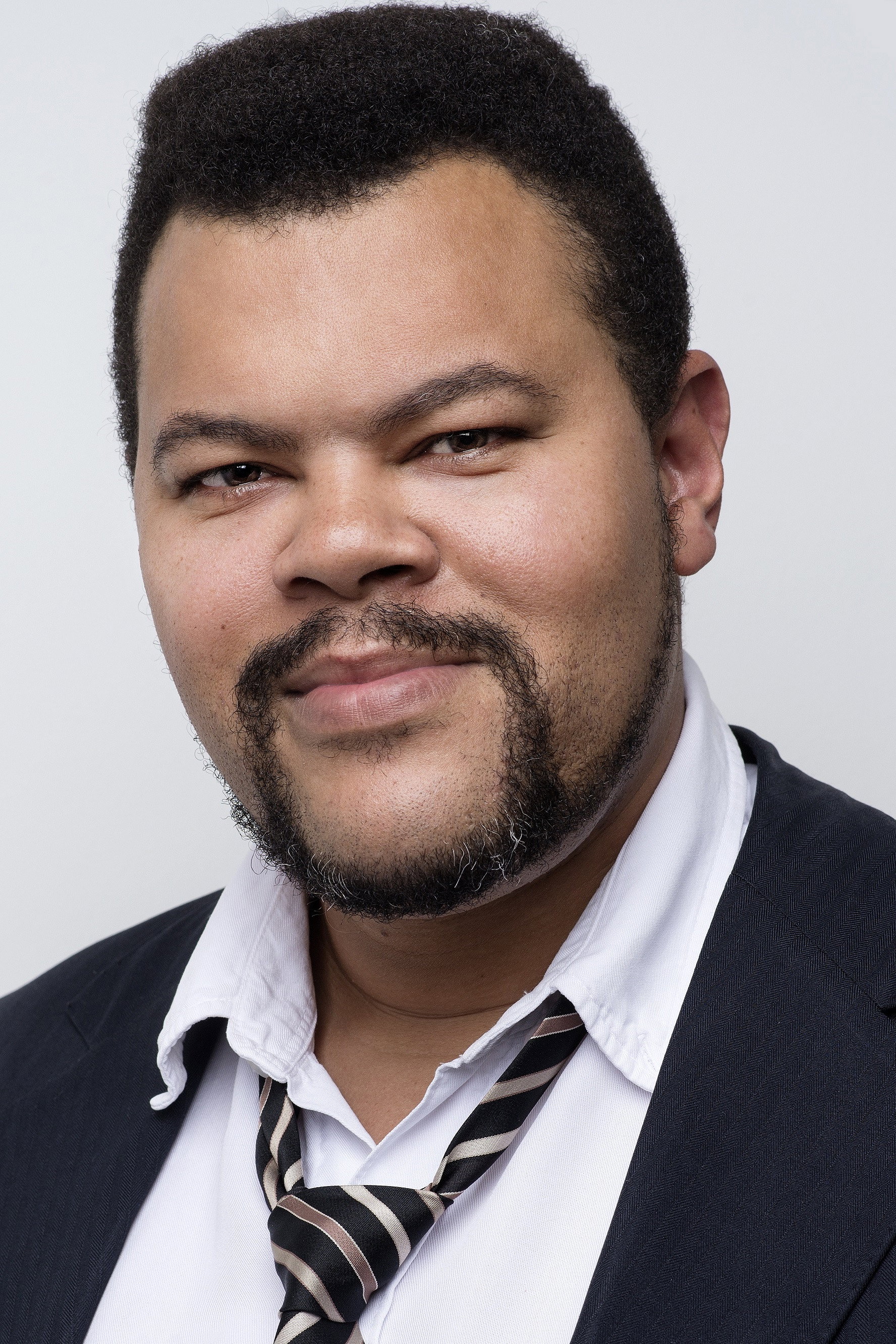 Babu Santana as Roque in Something in the Air