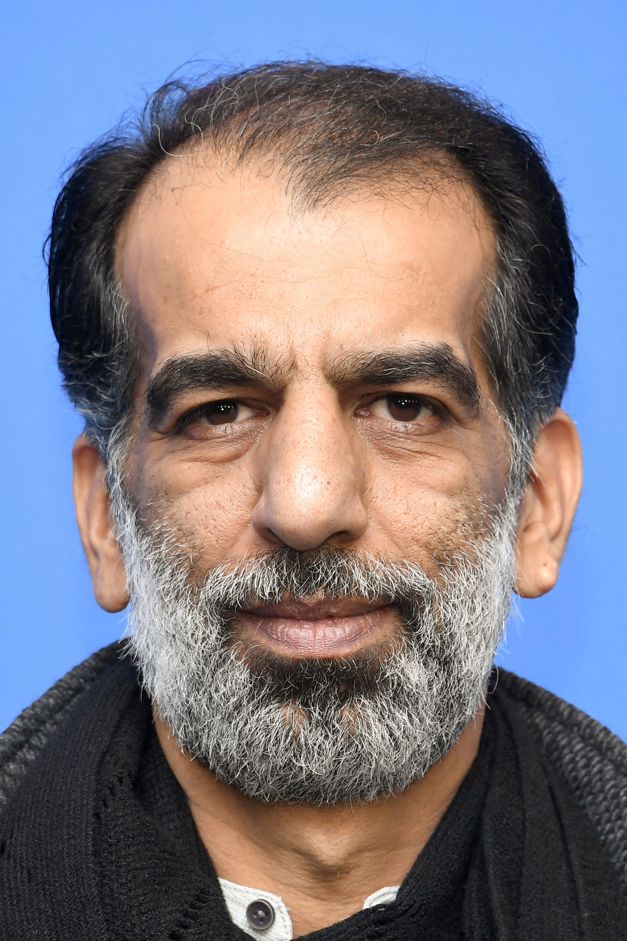 Ali Bagheri as Javad Charaki in A Dragon Arrives!