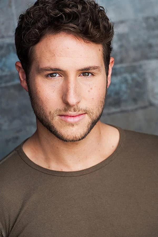 Griffin Burns as Ken (voice) in Barbie Mysteries