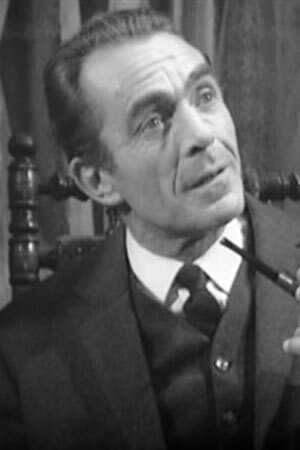 John Bailey as Mental Hospital Doctor in Cairo Road