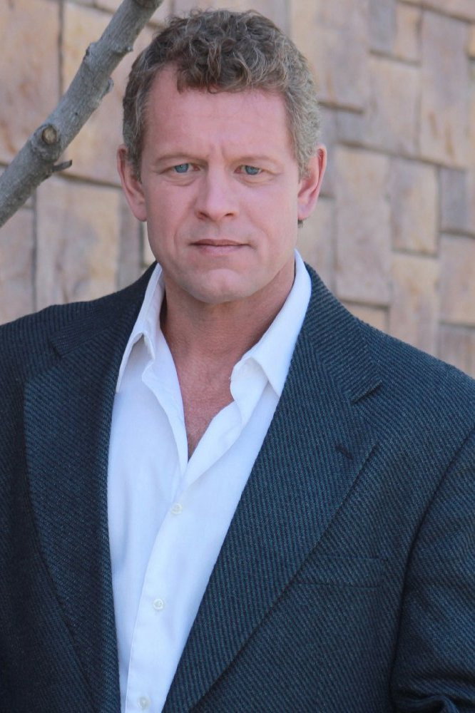 Chriss Anglin as Mr. Valentine in The Parallel