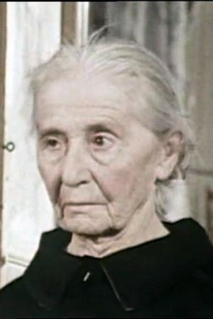 Nerina Montagnani as Old woman at the banquet in Taste of Life