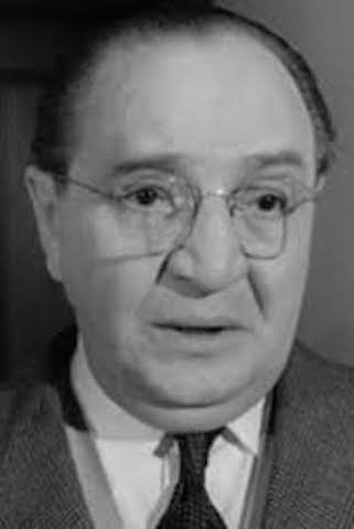 Meier Tzelniker as Mayer in Expresso Bongo