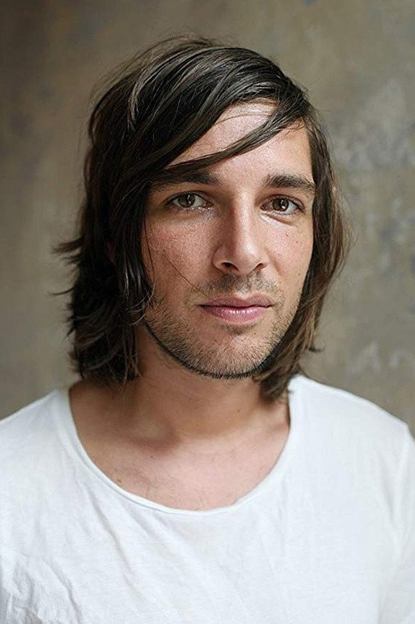 Toby Ashraf as Friend in the video in Looking for Simon