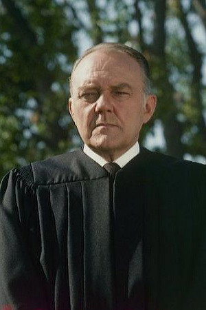 John O'Leary as Pharmacist in Moment by Moment