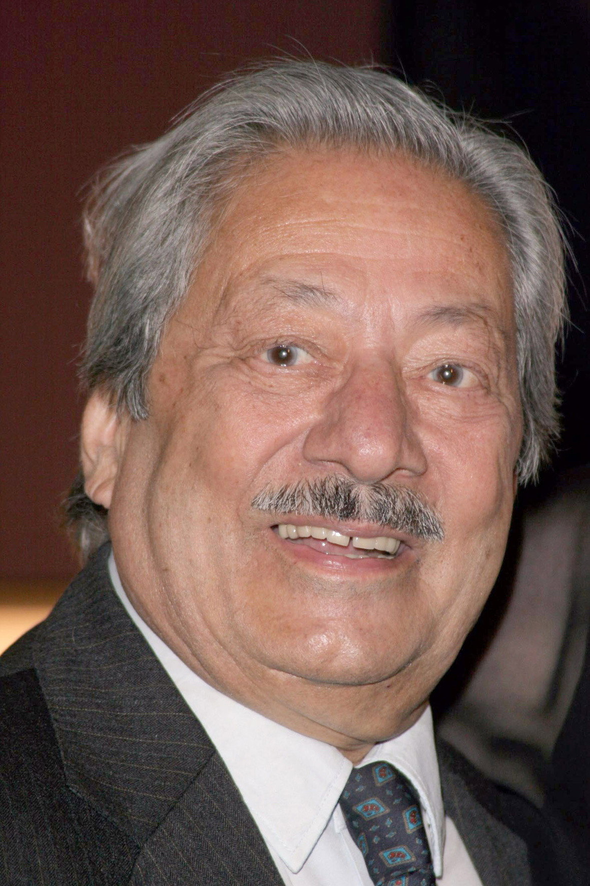 Saeed Jaffrey as Jimmy Sharma in Tandoori Nights