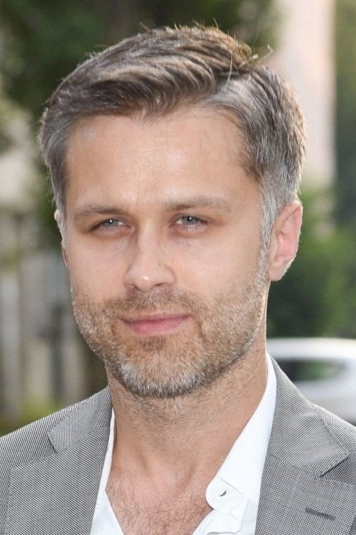 Maciej Zakościelny as Konstanty's Secretary in And a Warm Heart