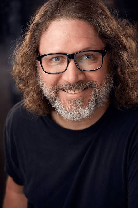 Brian James O'Connell as Podcast Host in Intrusive Thoughts