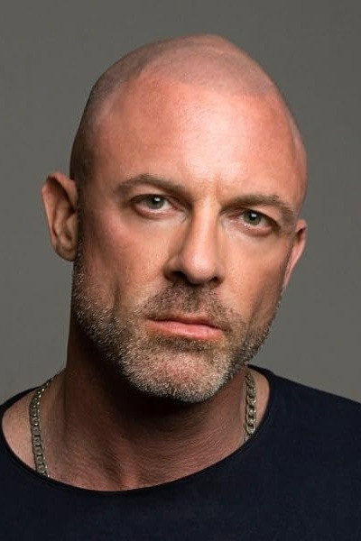 Benedict Garrett as Moshe in Dhak Dhak