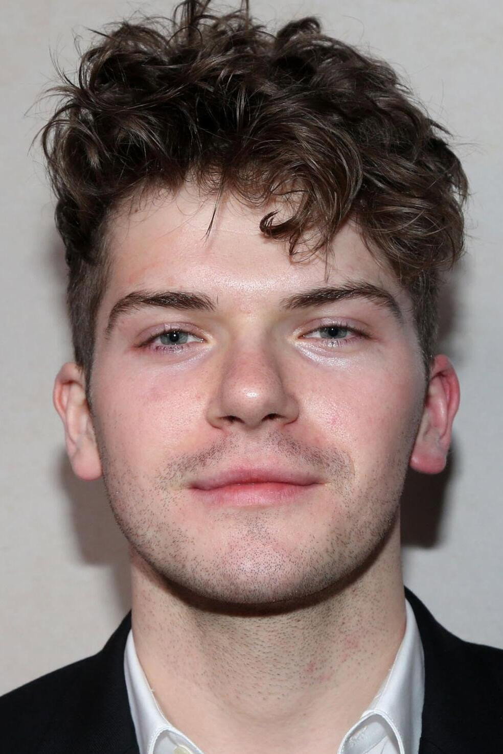 Colton Ryan as Conrad 'Coco' Roy III in The Girl from Plainville